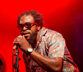 Lingfest 2019 Blunter Brothers singer at microphone against bright red background lighting ©Brett Butler